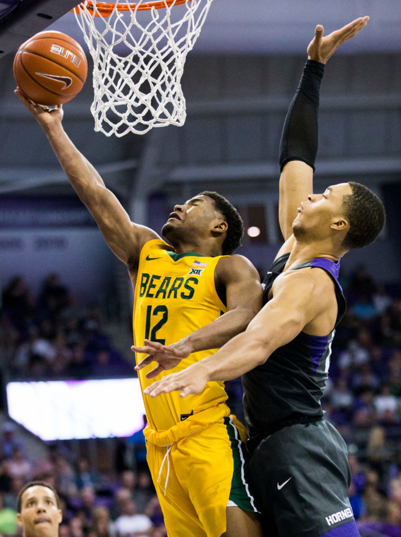 Baylor Bears guard Jared Butler (12) takes a shot ahead of TCU Horned Frogs forward Jaedon...