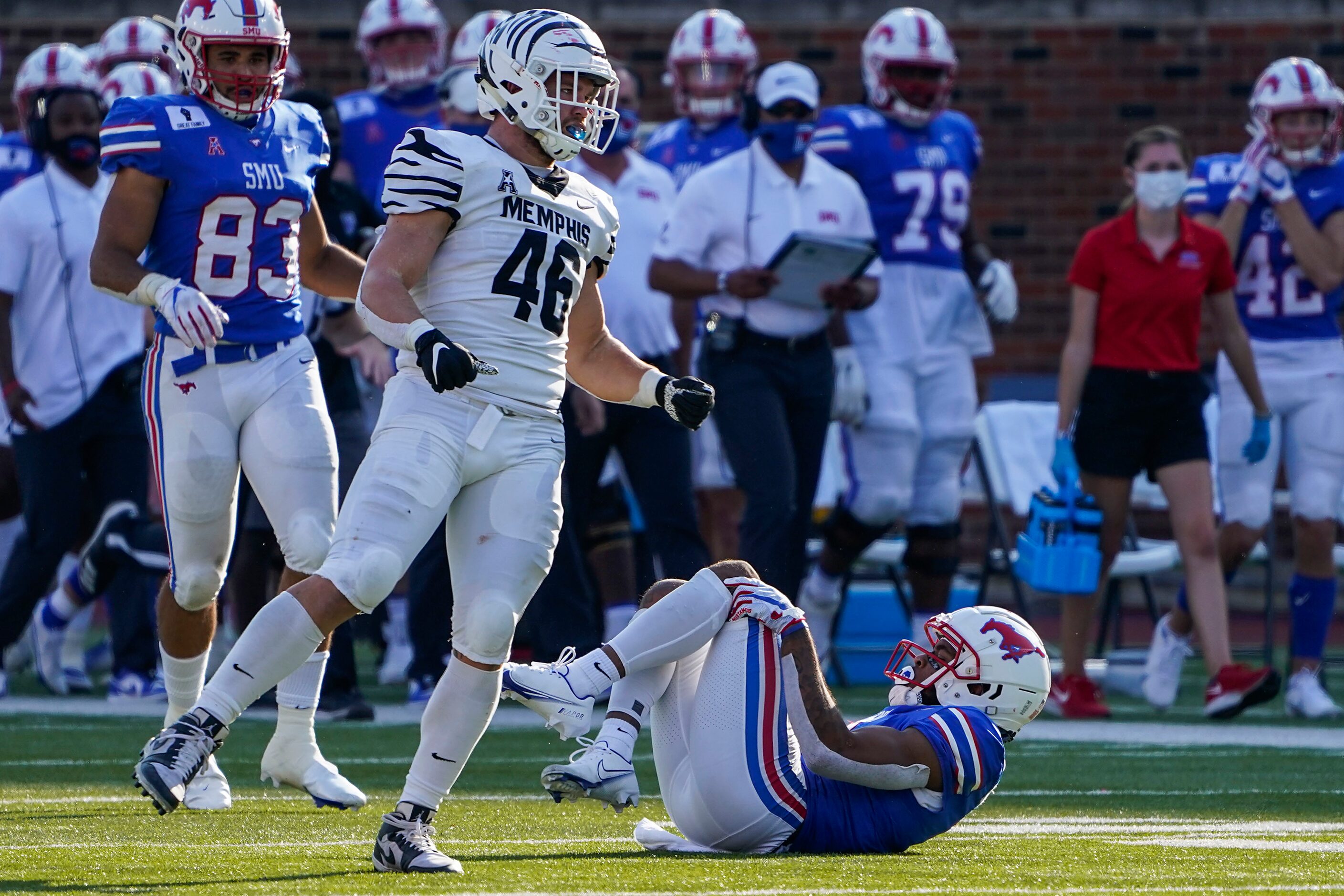 SMU wide receiver Reggie Roberson Jr. lies on the ground after being injured during the...