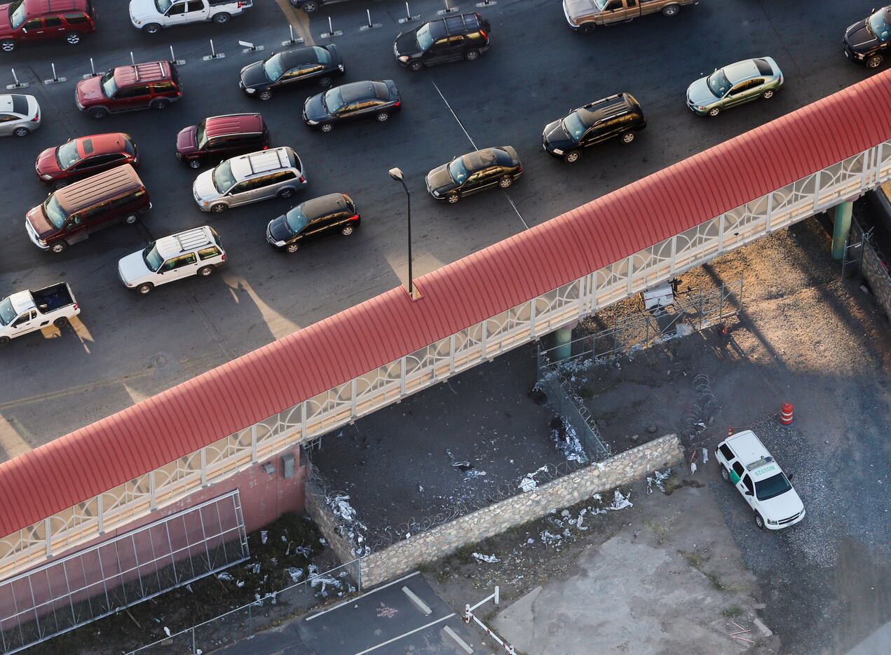 Shreds of Mylar blankets and a Border Patrol vehicle are seen under the Paso del Norte Port...