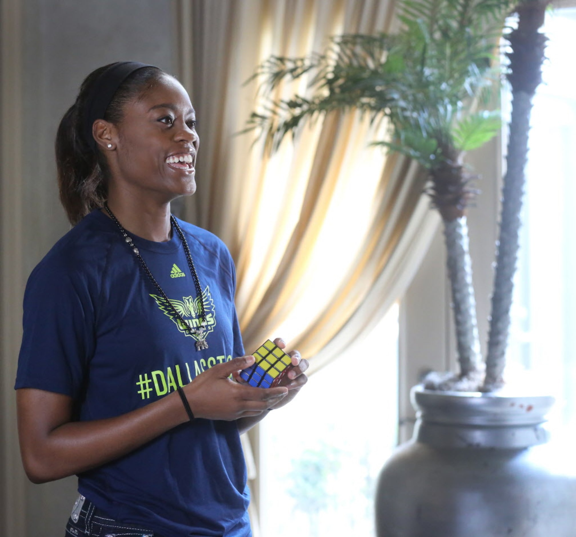 Dallas Wings guard Kaela Davis, who can solve a Rubik's Cube, is photographed at the home...