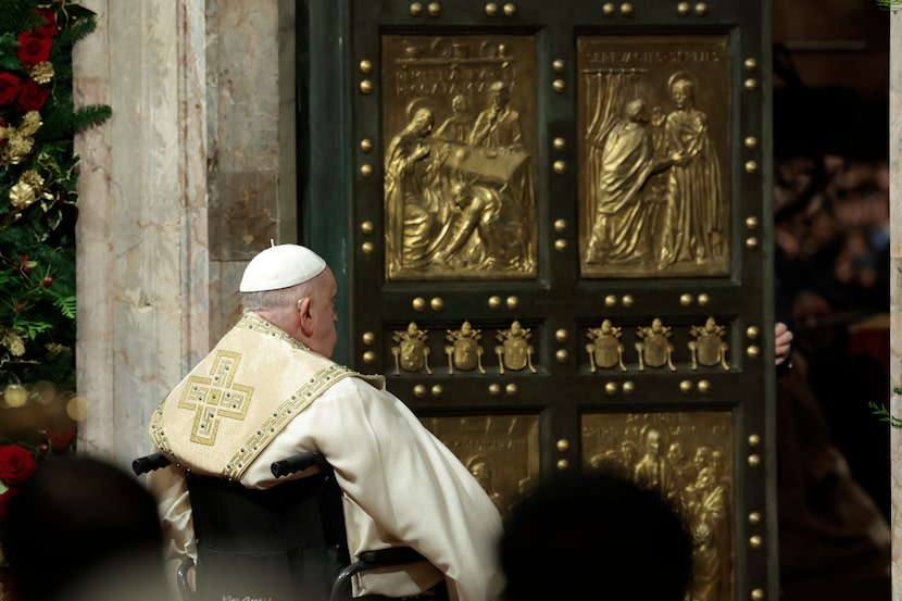 Pope Francis opens the Holy Door to mark the opening of the 2025 Catholic Holy Year, or...