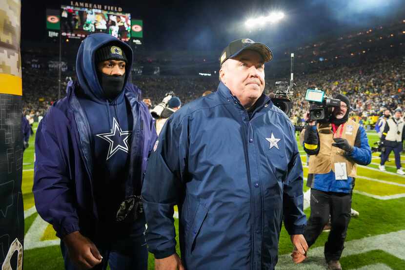 Dallas Cowboys head coach Mike McCarthy leaves the field after an overtime loss to the Green...