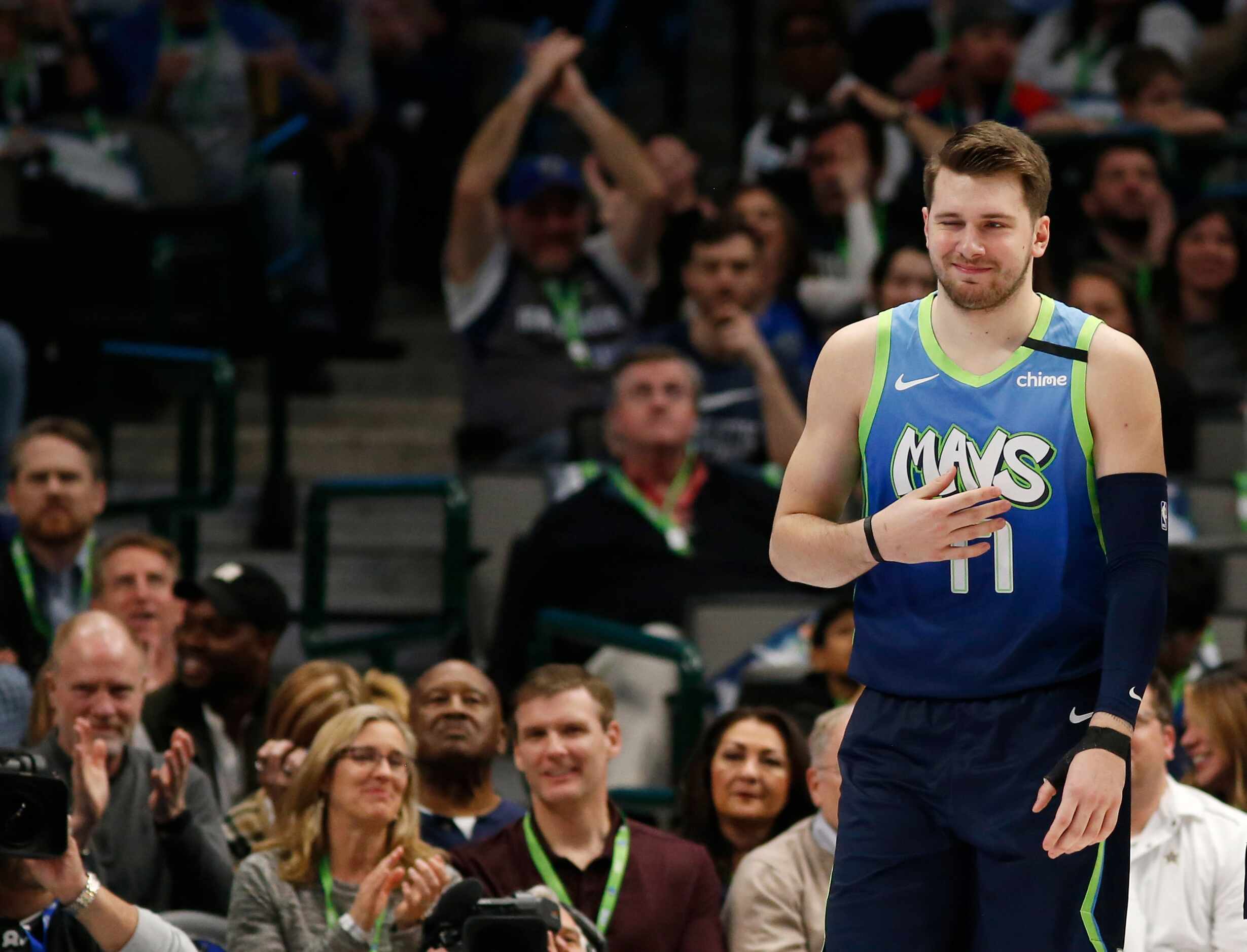 Dallas Mavericks guard Luka Doncic (77) winks after making a basket while being fouled in a...