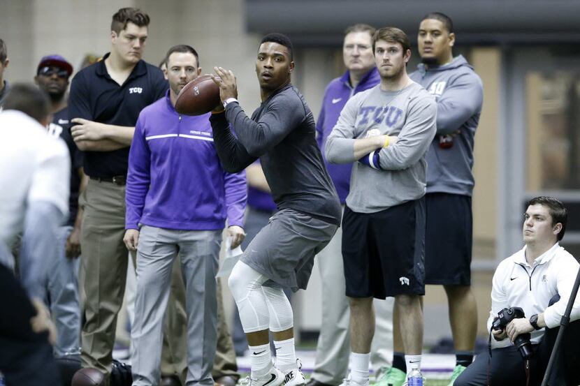 TCU's Trevone Boykin looks to pass during position drills at Pro Day at TCU in Fort Worth on...