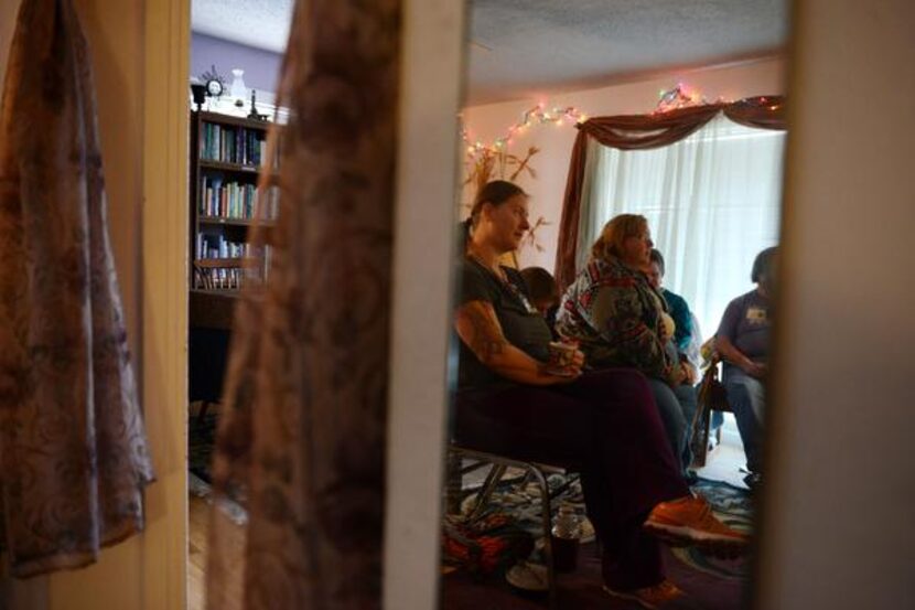 
Church member Elisha Martin (front) attends a Sunday service at Sacred Journey Fellowship...