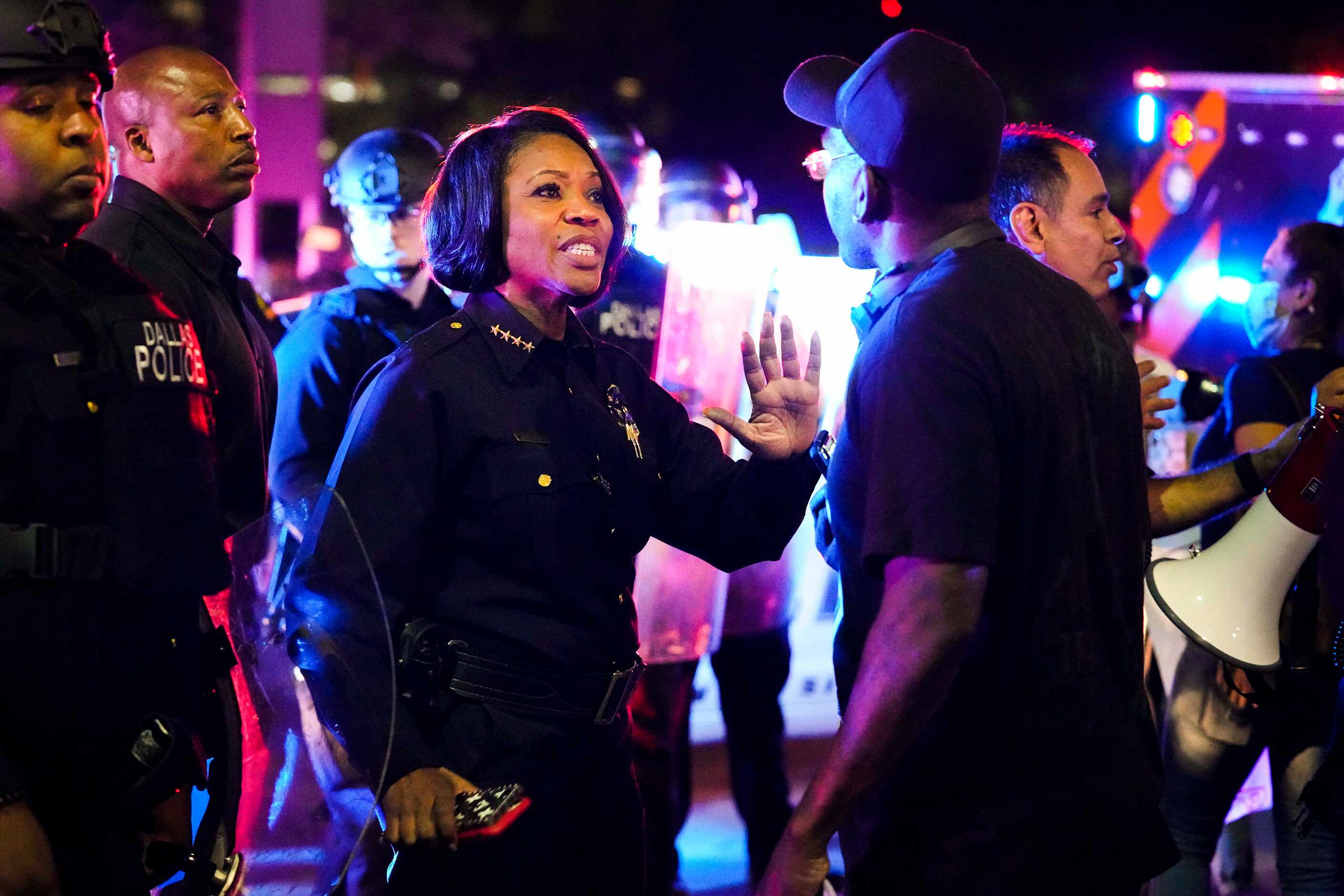 Dallas Police Chief Rene Hall tries to calm a protester at the corner of Griffin and Young...