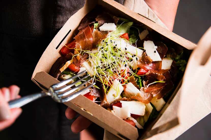 Salad in a takeout container