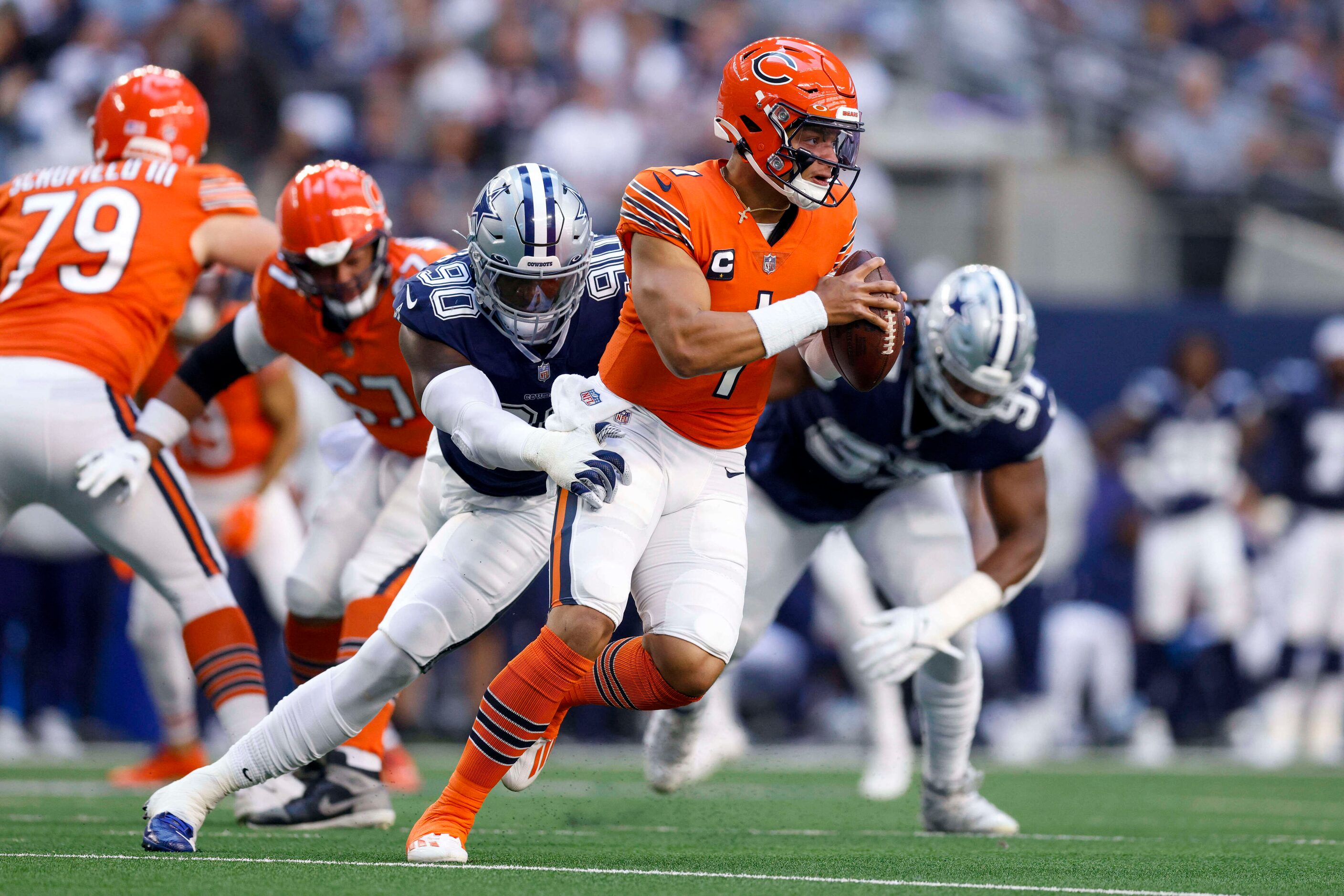 Dallas Cowboys defensive end DeMarcus Lawrence (90) pressures Chicago Bears quarterback...