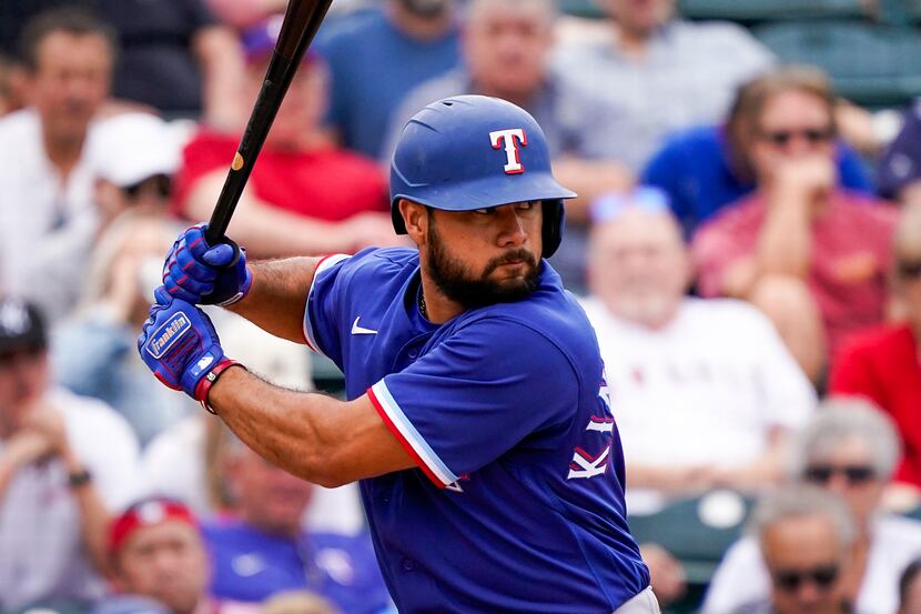 Texas Rangers infielder Isiah Kiner-Falefa bats during a spring training game against the...