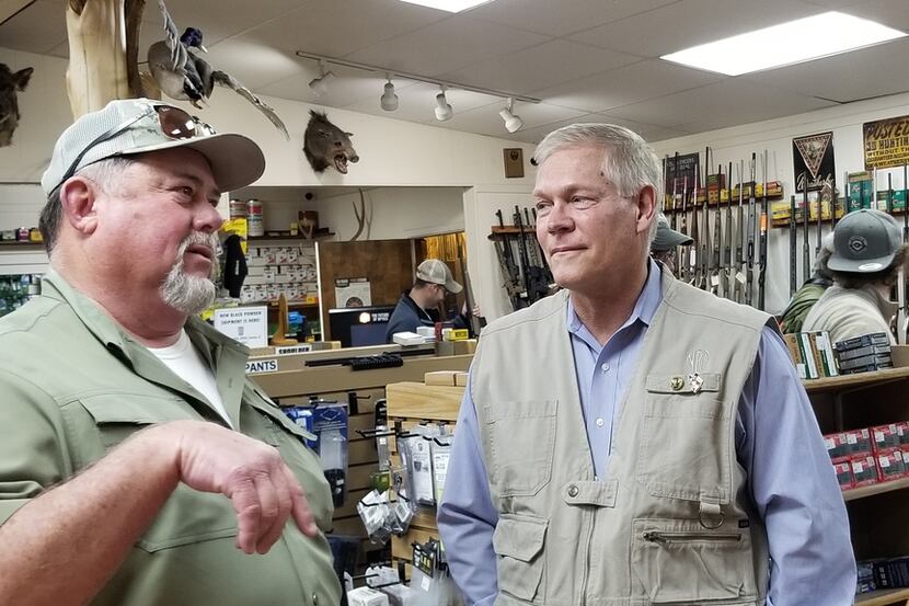 Former Dallas congressman Pete Sessions speaks with supporter Jerry Gribble, right, a local...