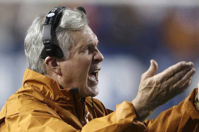 Texas head coach Mack Brown shouts to his team in the second quarter during Texas' 40-21...