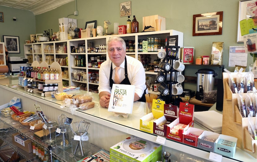 Ari Lowenstein, owner of Ari's Pantry, stands behind the counter of his Italian market...