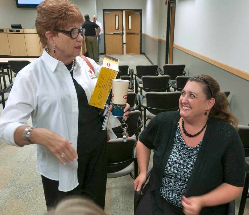 
Board member Leigh Plagens talks with Lesli Johnson, co-chair of the Rockwall ISD Bond...