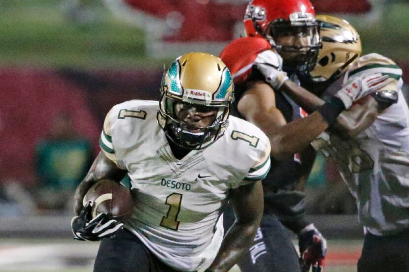 DeSoto wide receiver KD Nixon heads down the sidelines for a second quarter touchdown during...