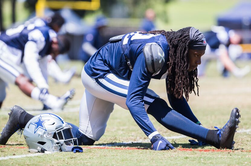 Dallas Cowboys cornerback Donovan Olumba (32) stretches during a morning practice at...