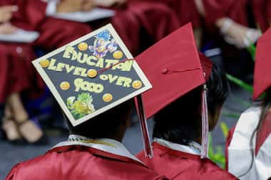 A decorated graduation cap is seen as students wait to walk the stage during a Dallas ISD...
