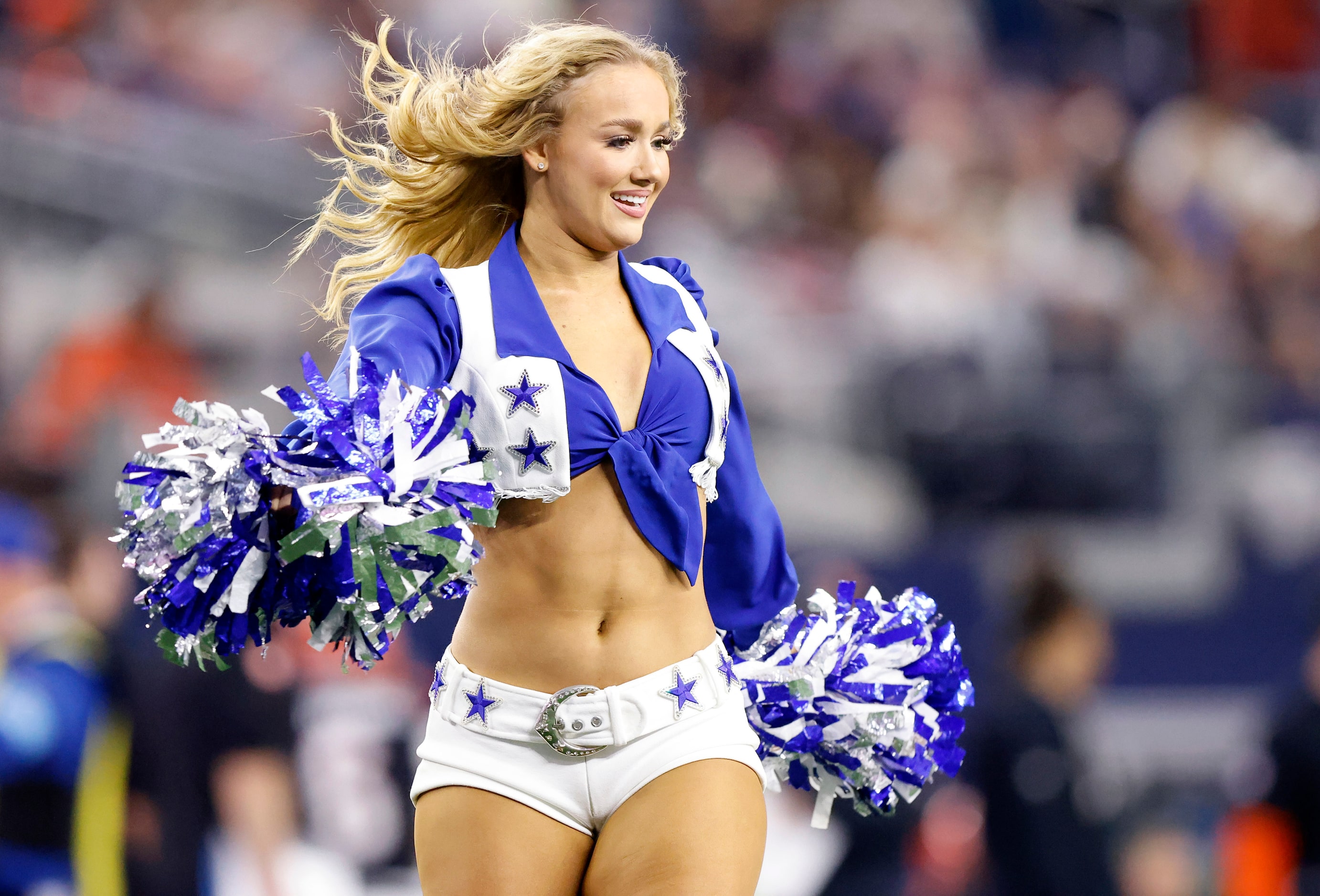 Dallas Cowboys Cheerleader Zoe Dale performs on the field following the first quarter of the...