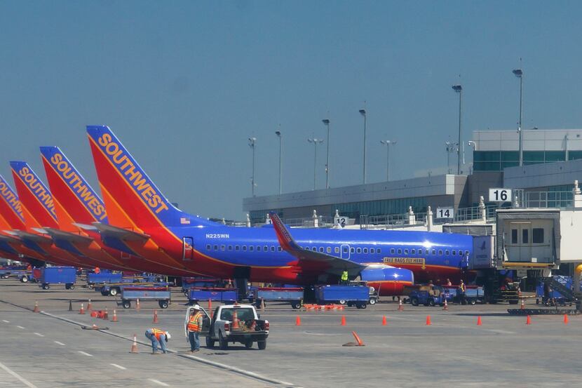  Southwest Airlines jets line up at the new Dallas Love Field terminal in this 2014 photo....