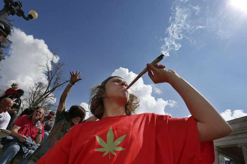  Partygoers listen to music and smoke marijuana on one of several days of the annual 4/20...