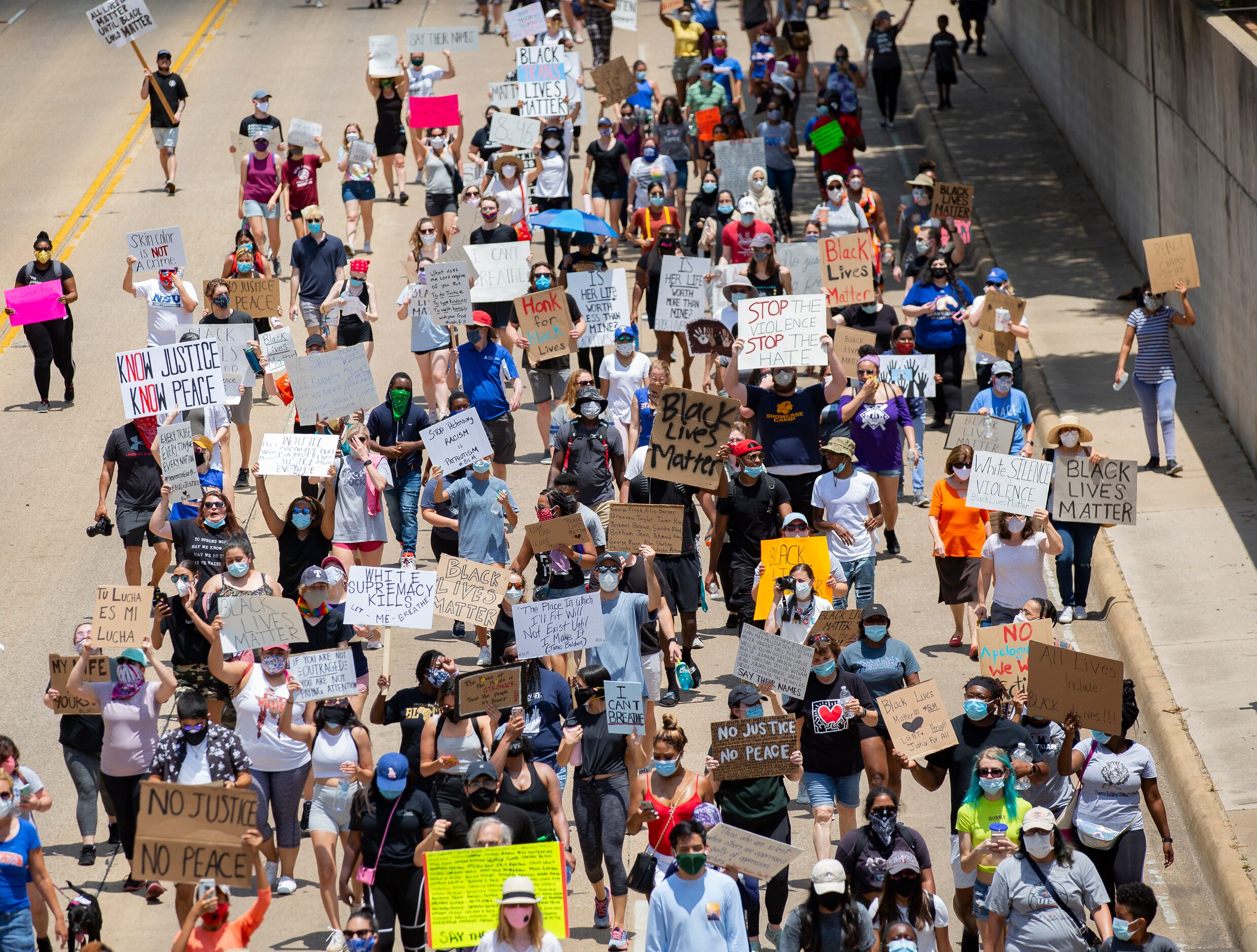 Protestors against police brutality march down S Cooper St as they participate in the UTA...