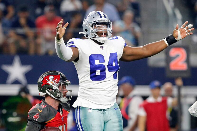 Dallas Cowboys defensive tackle Daniel Wise (64) celebrates his sack of Tampa Bay Buccaneers...