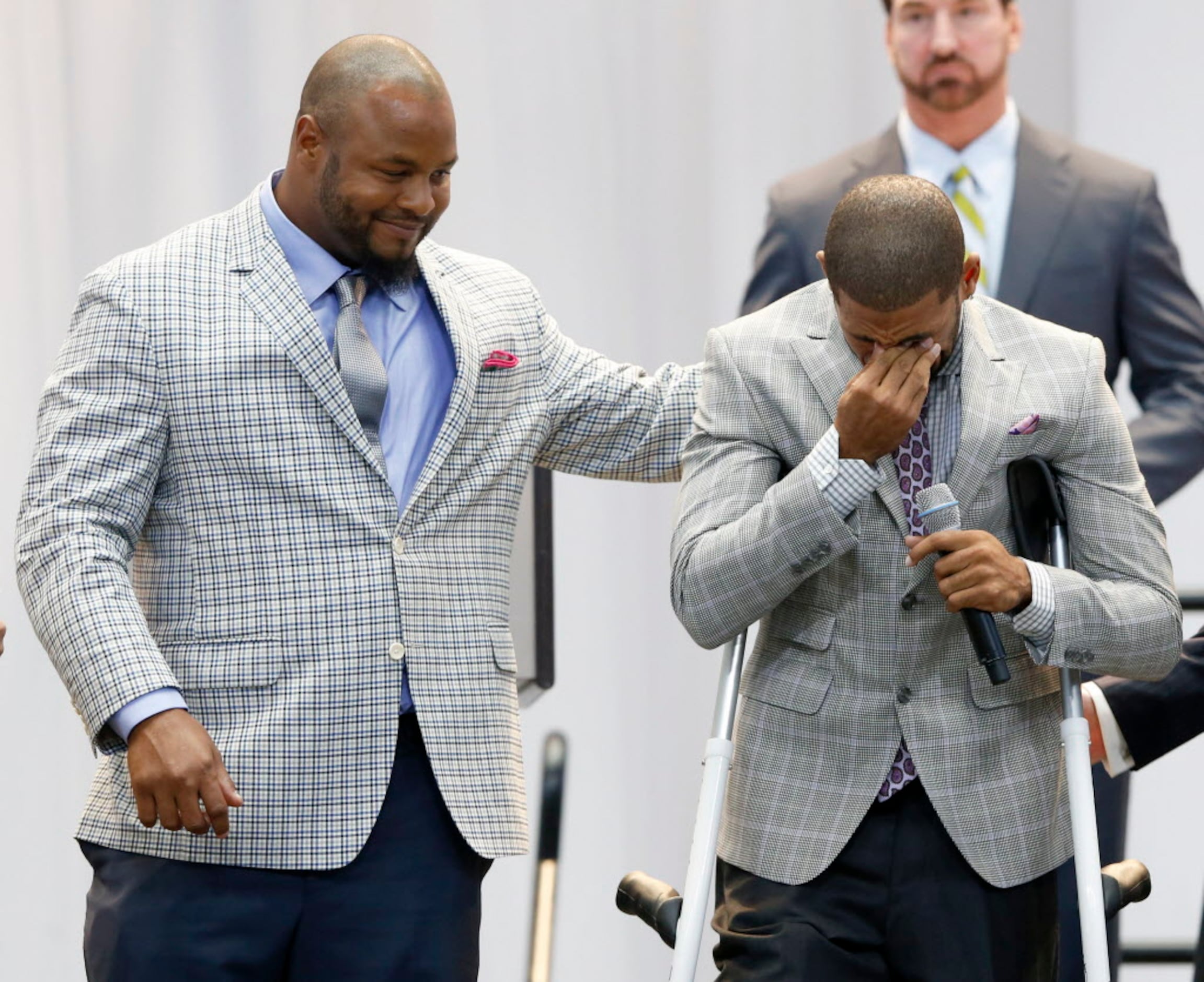 Dallas Cowboys cornerback Orlando Scandrick, left, has a discussion with  Rowdy the mascot before the Cowboys training camp at the Alamodome in San  Antonio, Texas, Thursday, July 30, 2009. (Photo by Ron