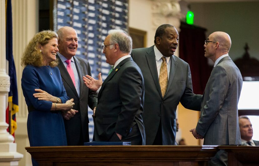 Sen. Kirk Watson (center) talked with Rep. Donna Howard and Sen. Kel Seliger, while Sen....