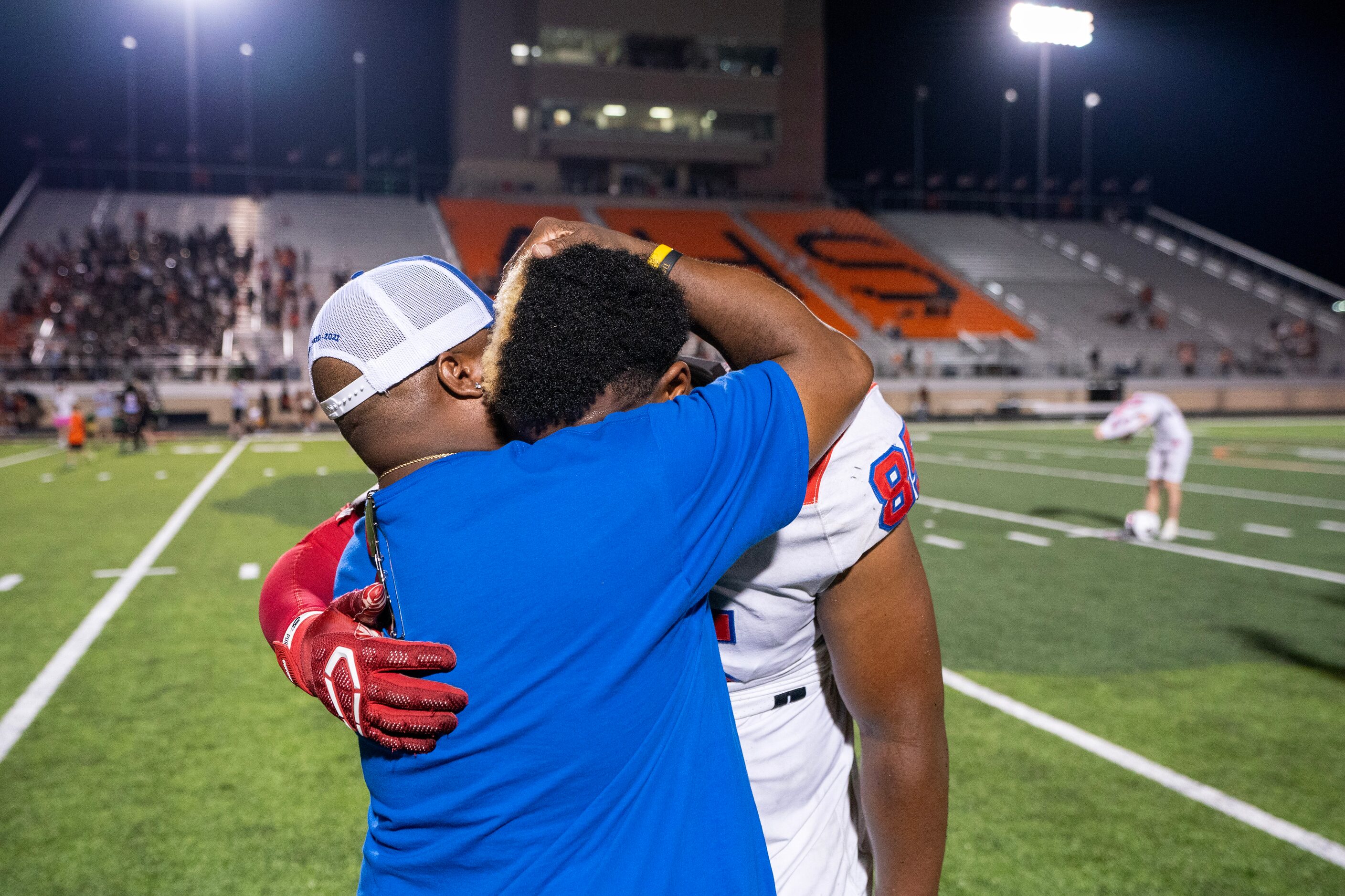 Parish Episcopal senior defensive lineman Caleb Mitchell Irving (85) is consoled by his...