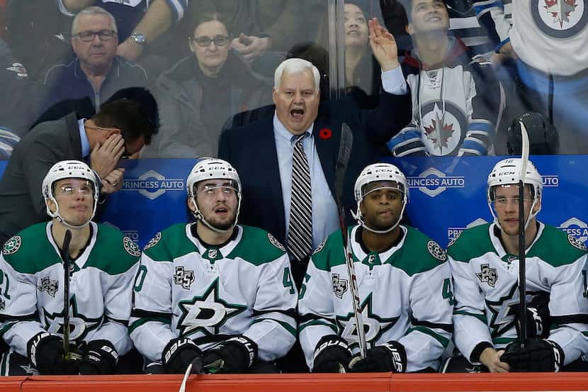 Dallas Stars head coach Ken Hitchcock challenges an apparent Winnipeg Jets goal during the...