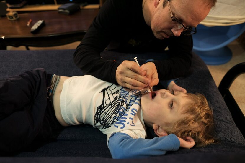 His father gives Elijah a cannabis oil extract.