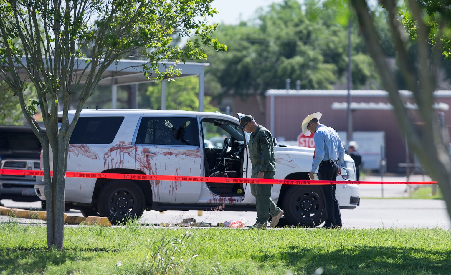 Authorities investigate the scene where Harris County Precinct 3 Assistant Chief Deputy...