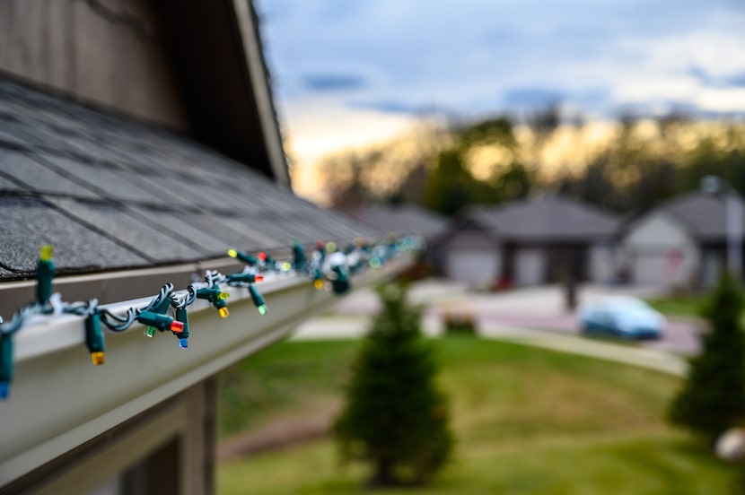 Lights attached to the side of a home for Christmas