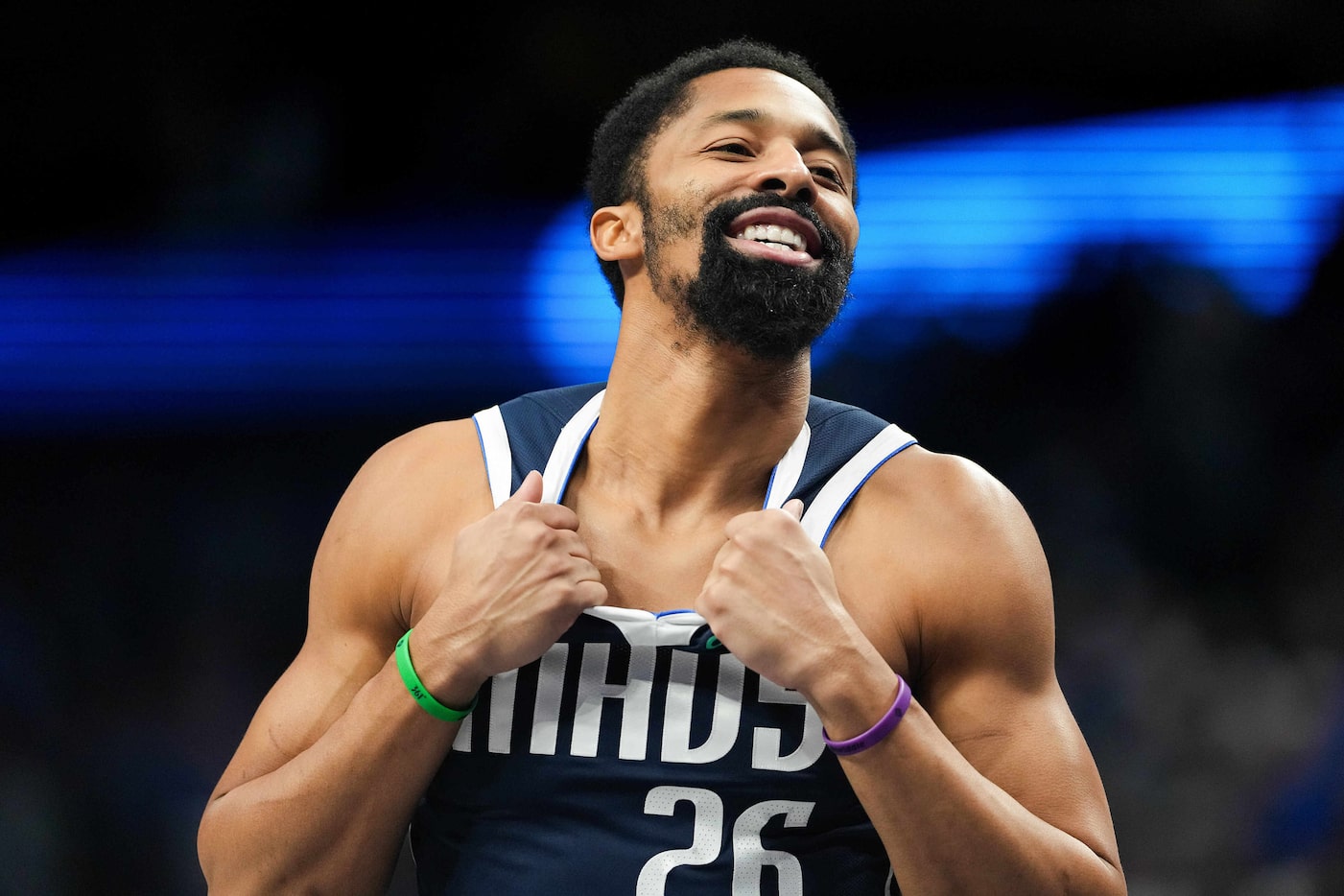 Dallas Mavericks guard Spencer Dinwiddie smiles as he takes the court for the opening tipoff...