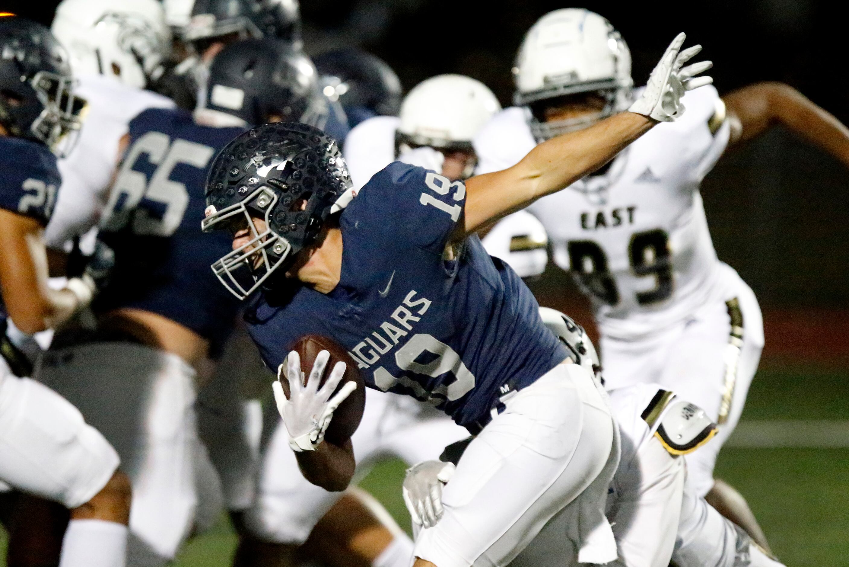 Flower Mound High School running back Cole Heilig (19) carries the ball close to the end...