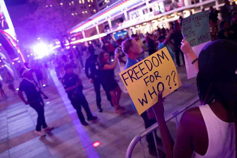 Abortion rights advocates protest in front of the AT&T Discovery District’s Red, White &...