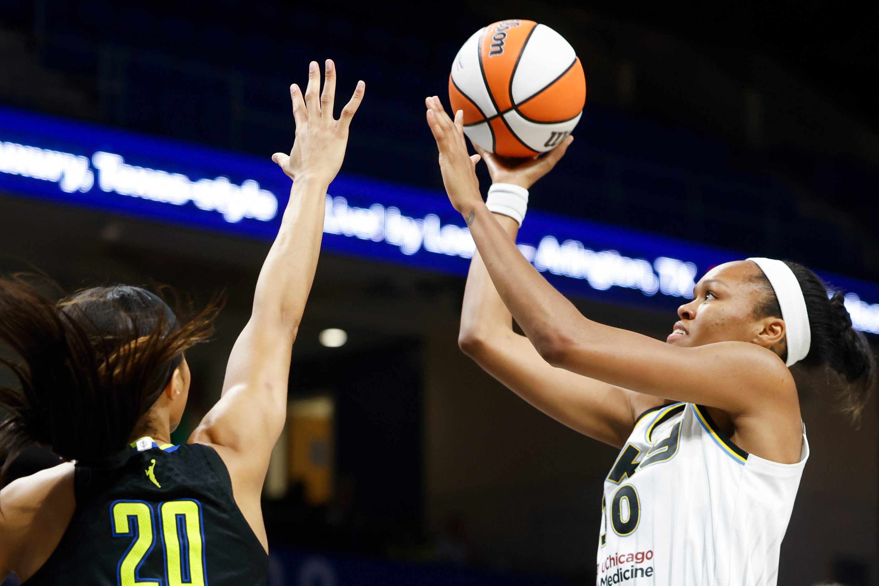 Chicago Sky forward Azura Stevens, right, drives to the basket as Dallas Wings forward...