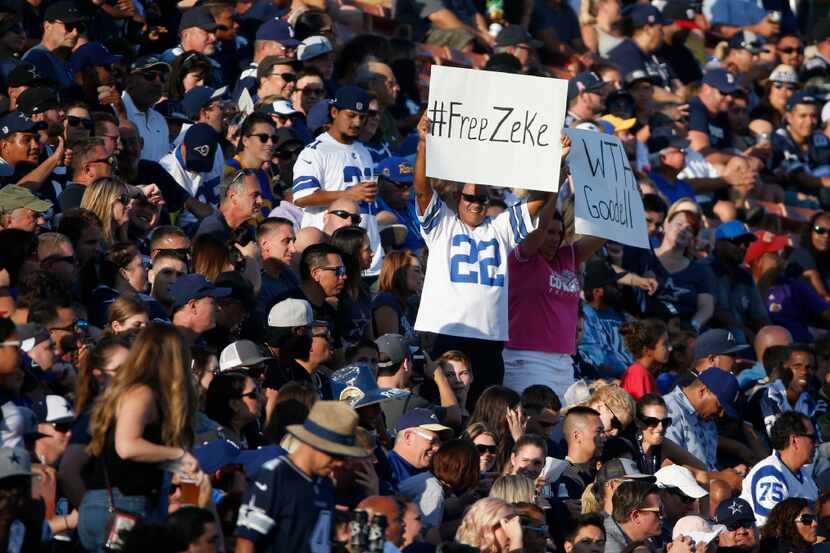 A Dallas Cowboys fan holds up a sign in support of Dallas Cowboys running back Ezekiel...