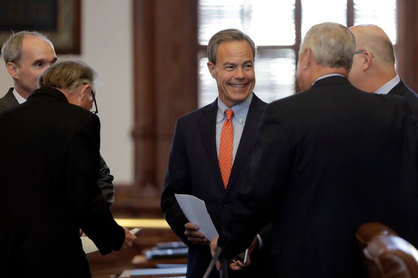 Texas Speaker of the House Joe Straus, R-San Antonio, center, visits with fellow lawmakers...