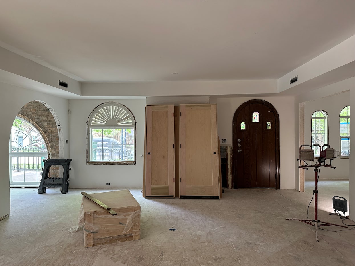 This view of the living room shows off the home's gorgeous arch details. The custom...