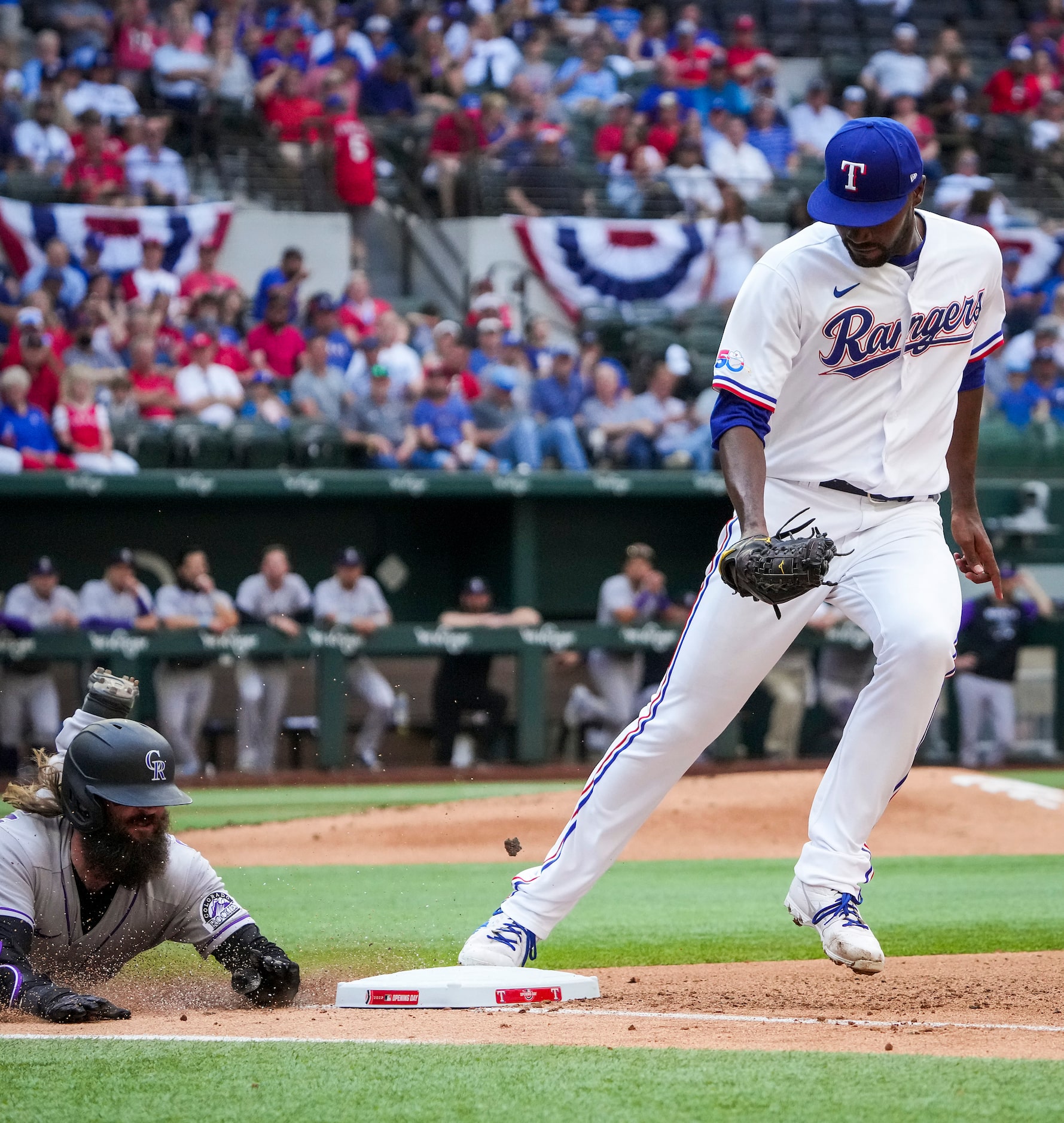 Texas Rangers pitcher Taylor Hearn beats Colorado Rockies right fielder Charlie Blackmon to...