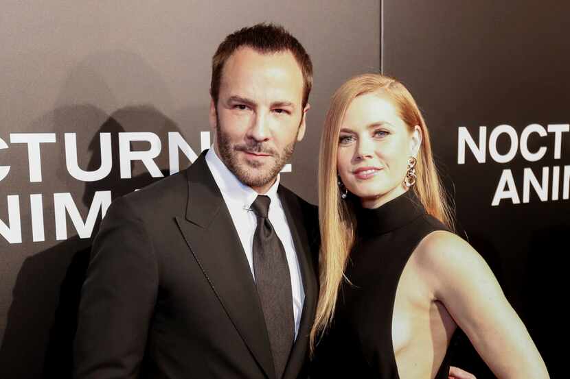 Tom Ford, left, and Amy Adams arrive at the LA Special Screening of "Nocturnal Animals" at...
