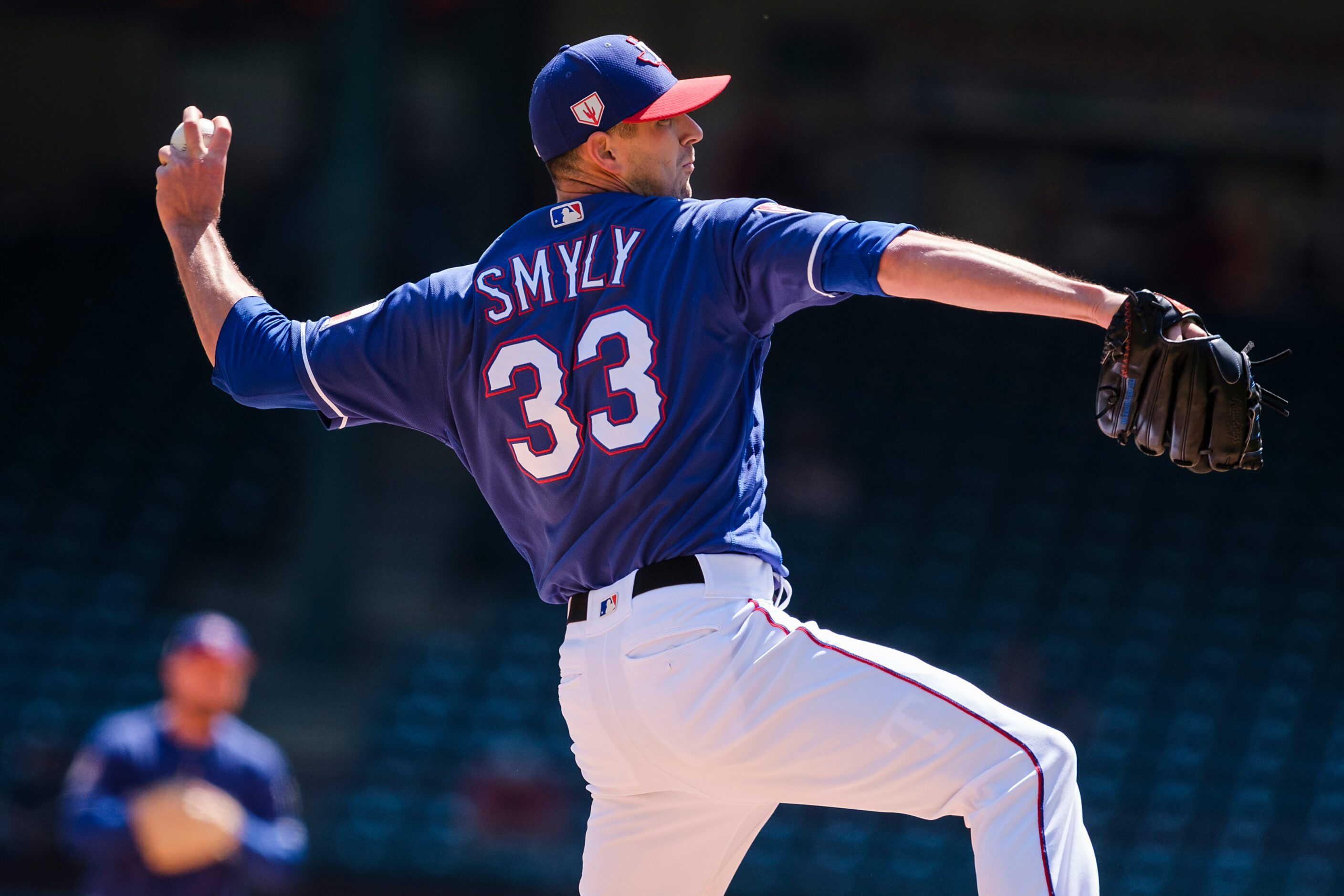 Texas Rangers pitcher Drew Smyly pitches during the fourth inning of a spring training...