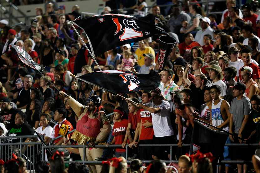 Euless Trinity fans cheer from the stands during a game between Euless Trinity and Jenks at...