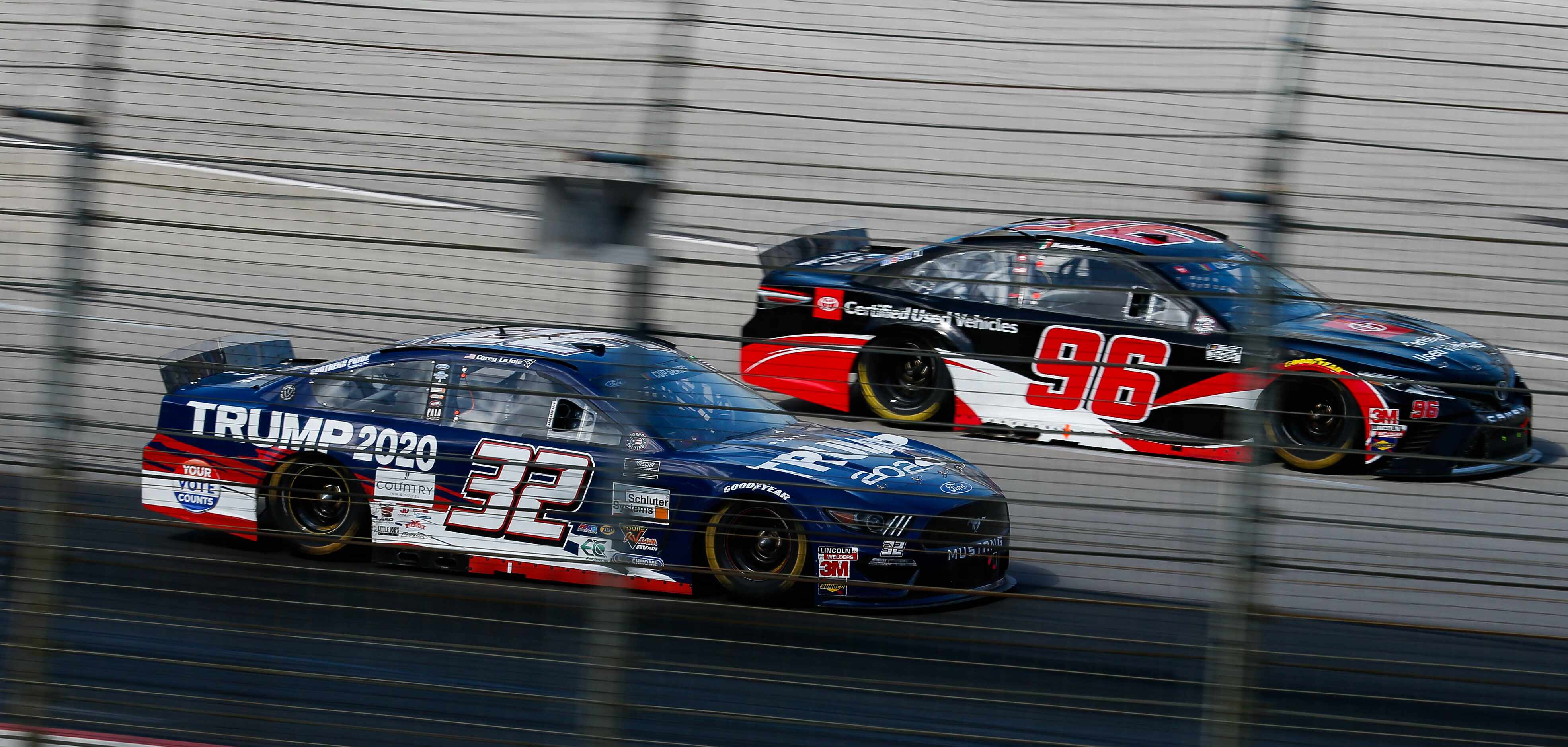 Drivers Daniel Suarez (No. 96) and Corey LaJoie (No. 32) race during the NASCAR Cup Series...