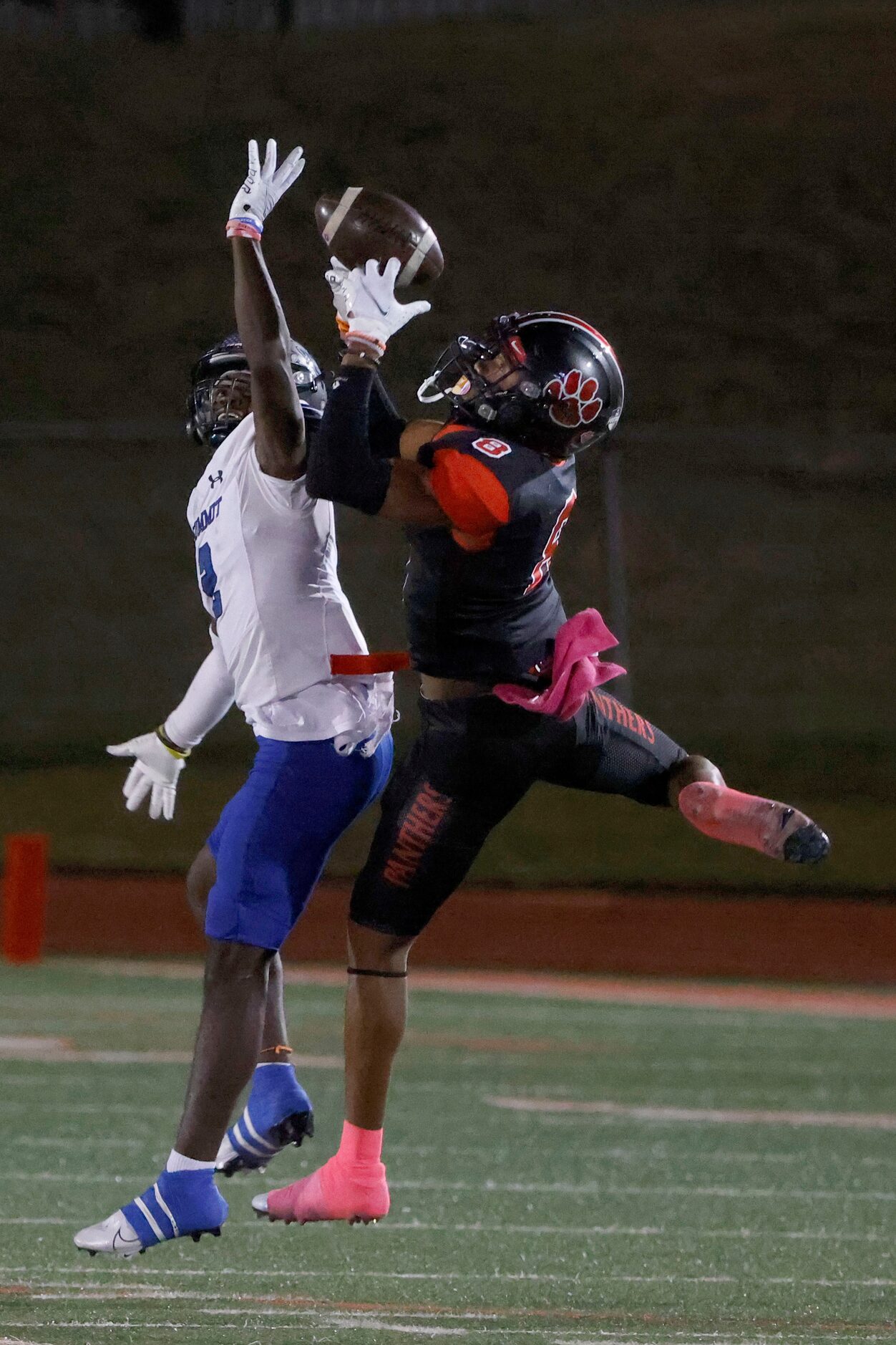 Colleyville Heritage defender Dylahn McKinney (8) makes an interception in front of...