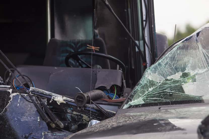A truck is seen in front of a bus, both involved in the fatal wreck on Interstate 10 near...