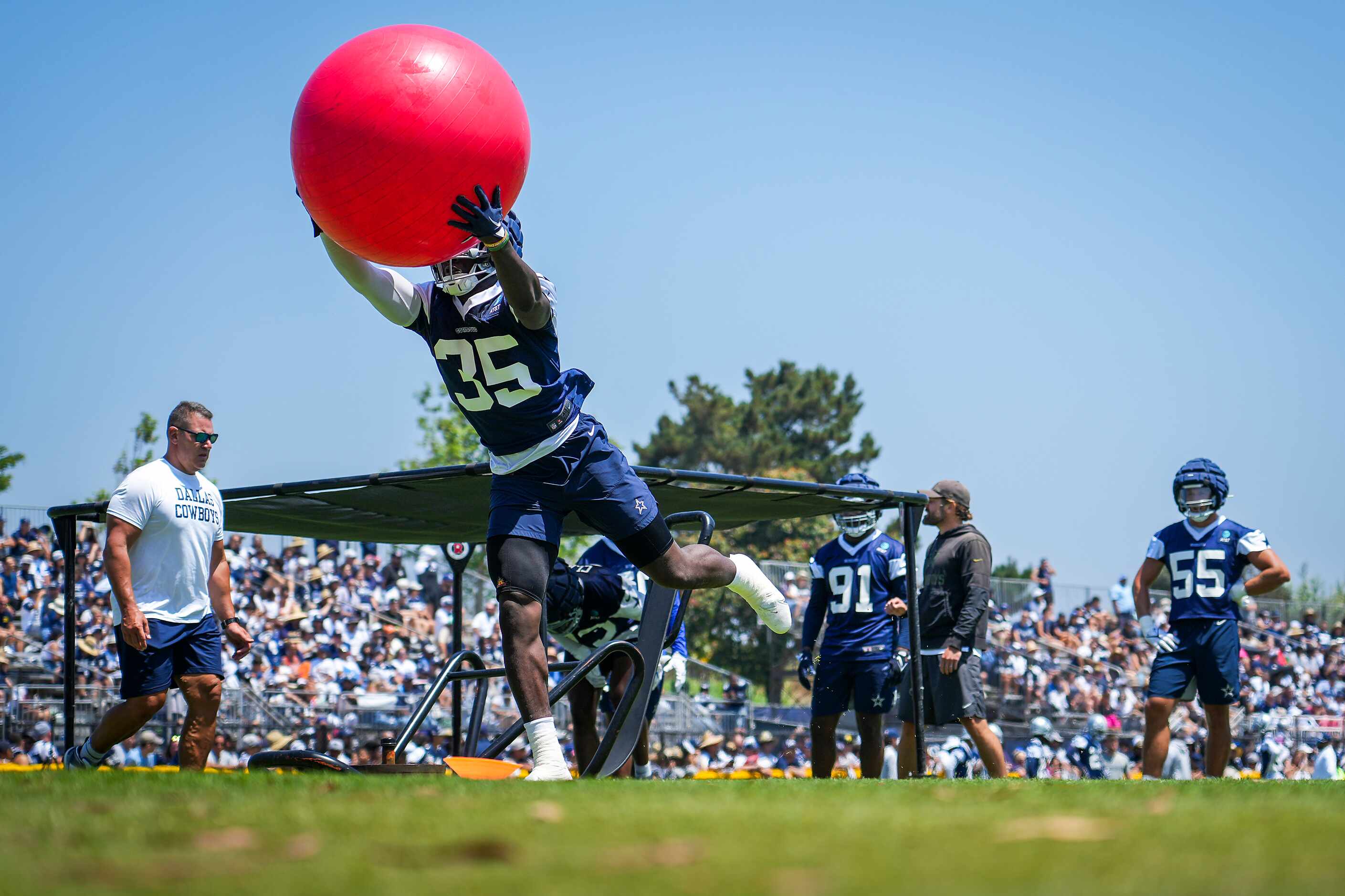 Dallas Cowboys linebacker DeMarvion Overshown participates in a drill during a training camp...