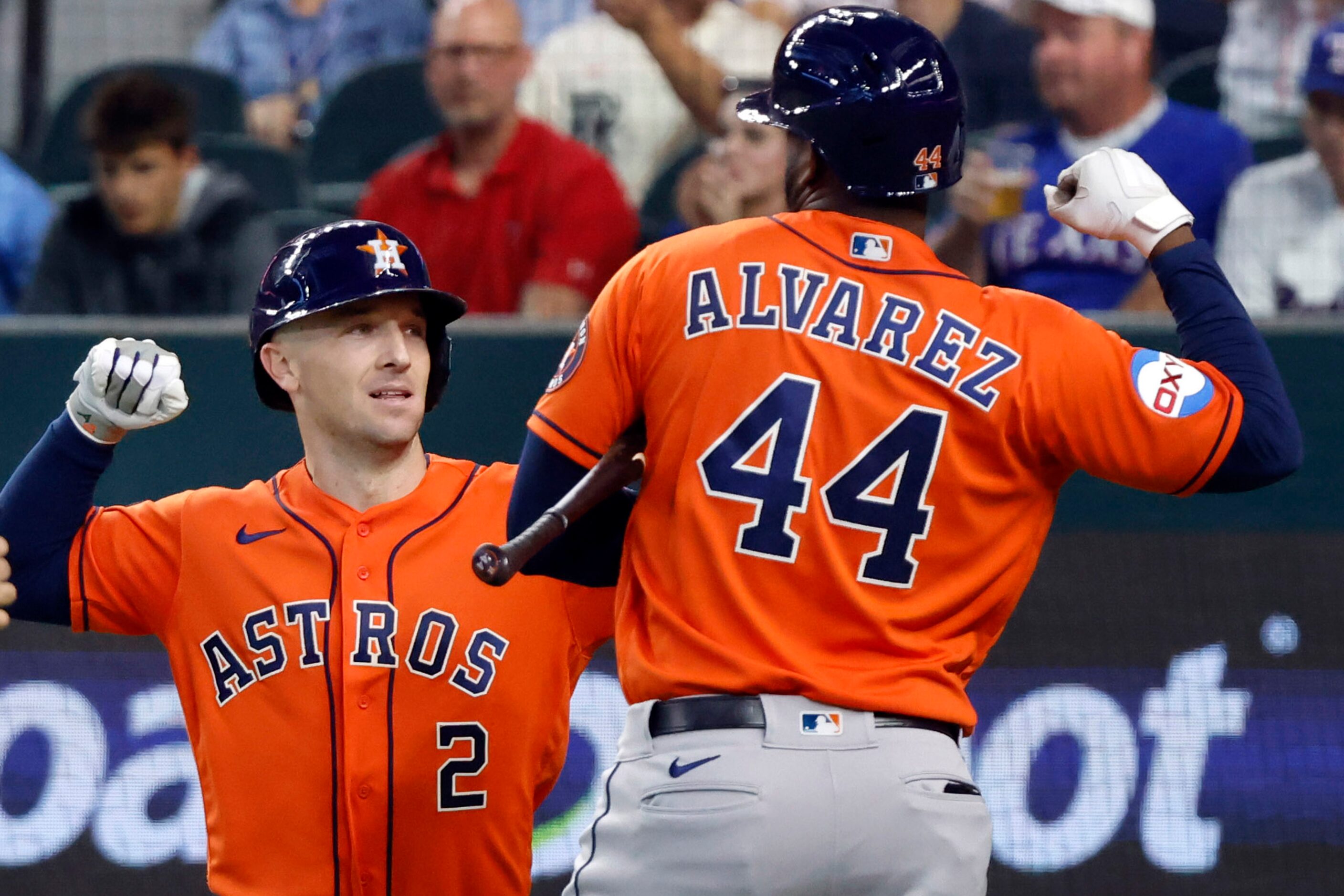 Houston Astros designated hitter Yordan Alvarez (44) congratulates Alex Bregman (2) on his...