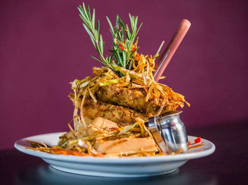 The sage fried chicken and waffles come artfully dressed.