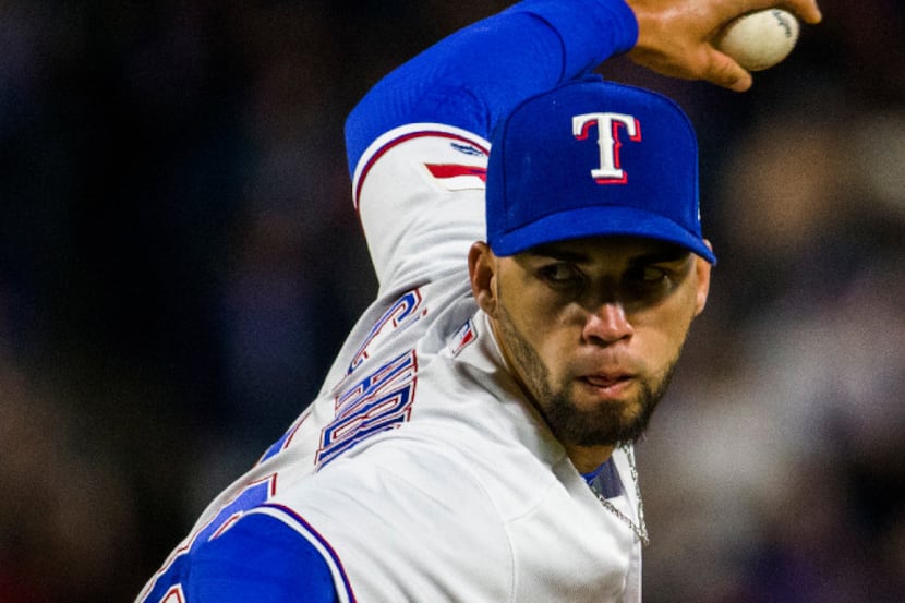 Texas Rangers relief pitcher Alex Claudio (58) pitches during the seventh inning of an MLB...